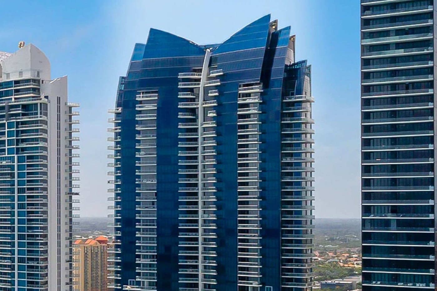 Jade Ocean's blue glass tower and sail-shaped crown on the Sunny Isles oceanfront