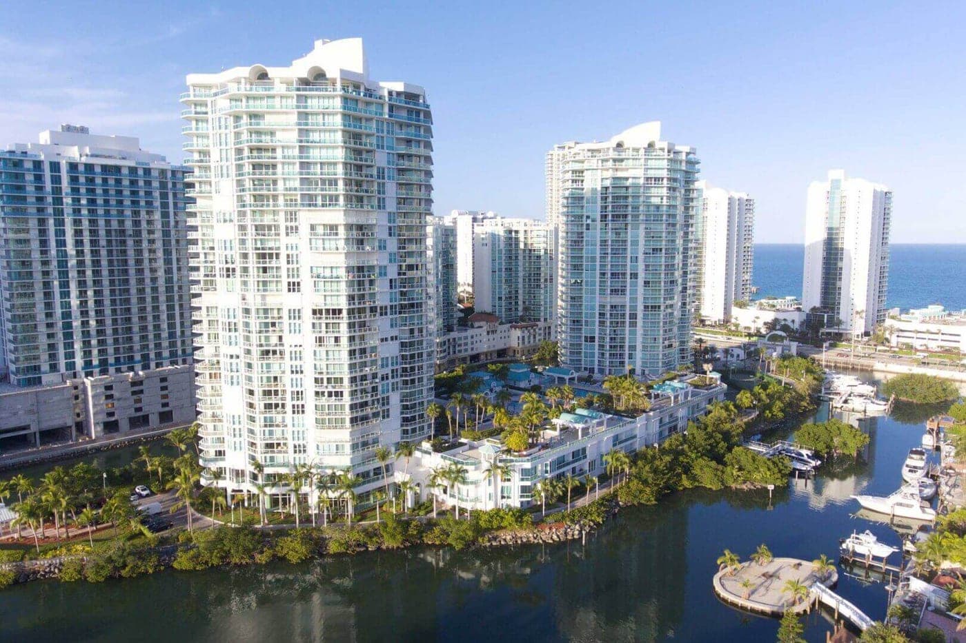 Oceania V on Oceania Island, Sunny Isles Beach, with its bayfront townhouses at the base and the marina below
